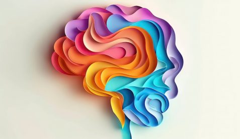 Abstract colorful paper art with wavy lines on a white background.